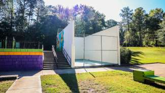 Outdoor handball court enclosure at Peach Road Park 