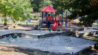 Playground for ages 2 to 12 with multiple swings and slides 