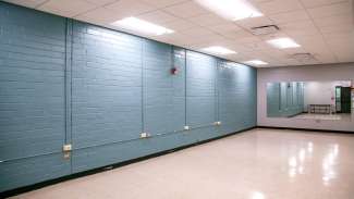 A medium sized meeting room with a giant mirror at Worthdale Park 