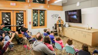 An instructor giving a lesson on Astronomy 