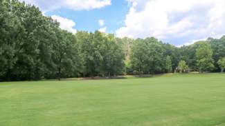 A large open grass field used for programs, sports and more