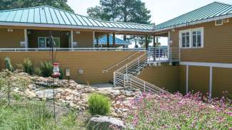 landscaping and stairs in front of lake wheeler office