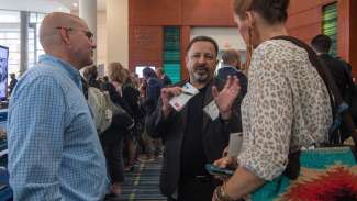 people chatting in hallway during smart cities summit 