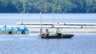 Two people rowing in a canoe at lake wheeler 