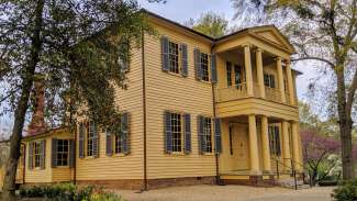 View of the exterior of the Mordecai Historic House in springtime