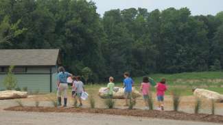 Nature staff leading a group of kids during a program at Annie Louise Wilkerson 