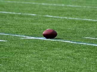 Football on field grass