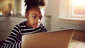 Girl sitting at laptop