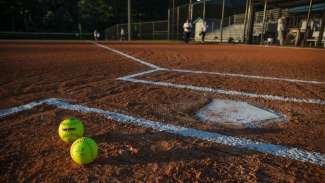 View of home base with two softballs