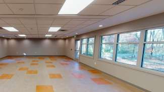 Interior room of Eastgate Neighborhood Center with tile and windows