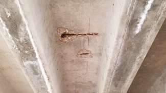 Shows age and damage on underside of Shelley Rod bridge