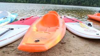 View of kayaks on lake shore