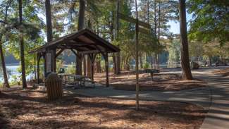 Wooden Shelter on the edge of trail and lake