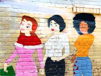 No Damsel mural of three Disney princesses 