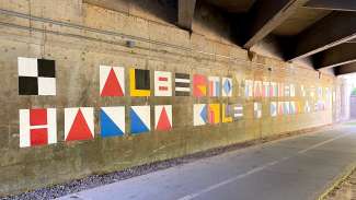 Mural on the wall of an overpass for the floodplain project on Crabtree Creek