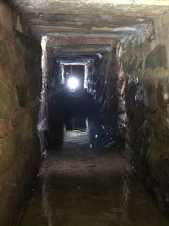 A section of Cemetery Creek that runs under ground. This images shows a stone block culvert near Elm Street, built in the early 1800's. 