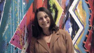 A headshot of 2022 Raleigh Medal of Arts awardee June Guralnick