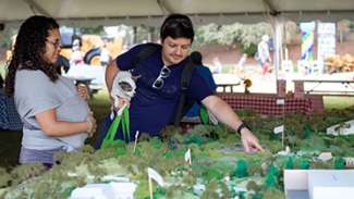 A couple looking at a tabletop display