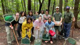 group of teens in the nature with dip nets