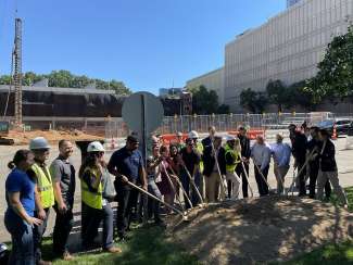 The design team and construction team gathered at dirt for groundbreaking 