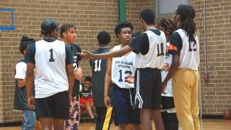 raleigh teen zone members playing basketball