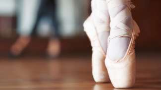 an image of ballet shoes on tippy toes