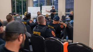 Officers attend a briefing meeting