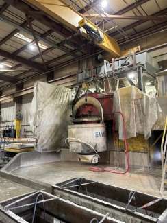 image shows the concrete hopper getting ready to pour concrete into the panel form that will one day be a part of the new City Hall.  